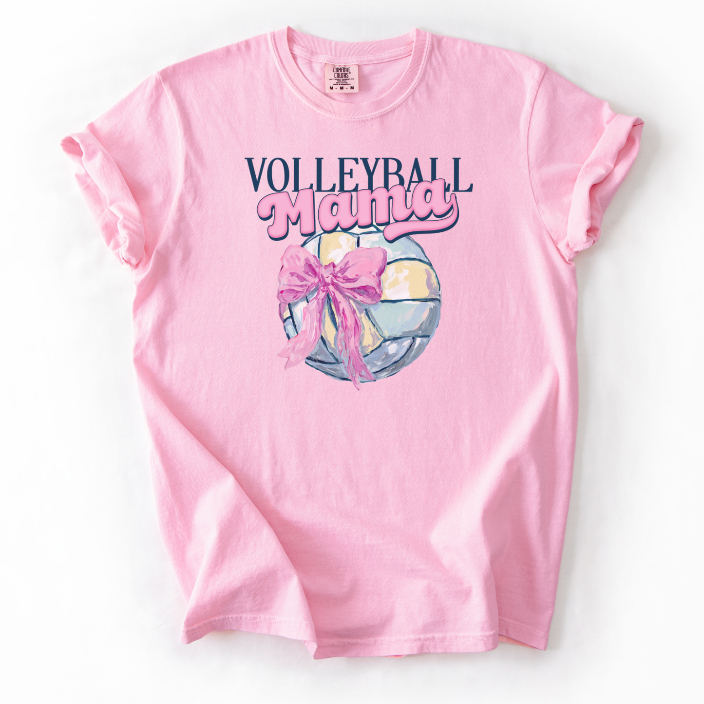 Pink t-shirt with 'Volleyball Mama' text and volleyball graphic on a white background