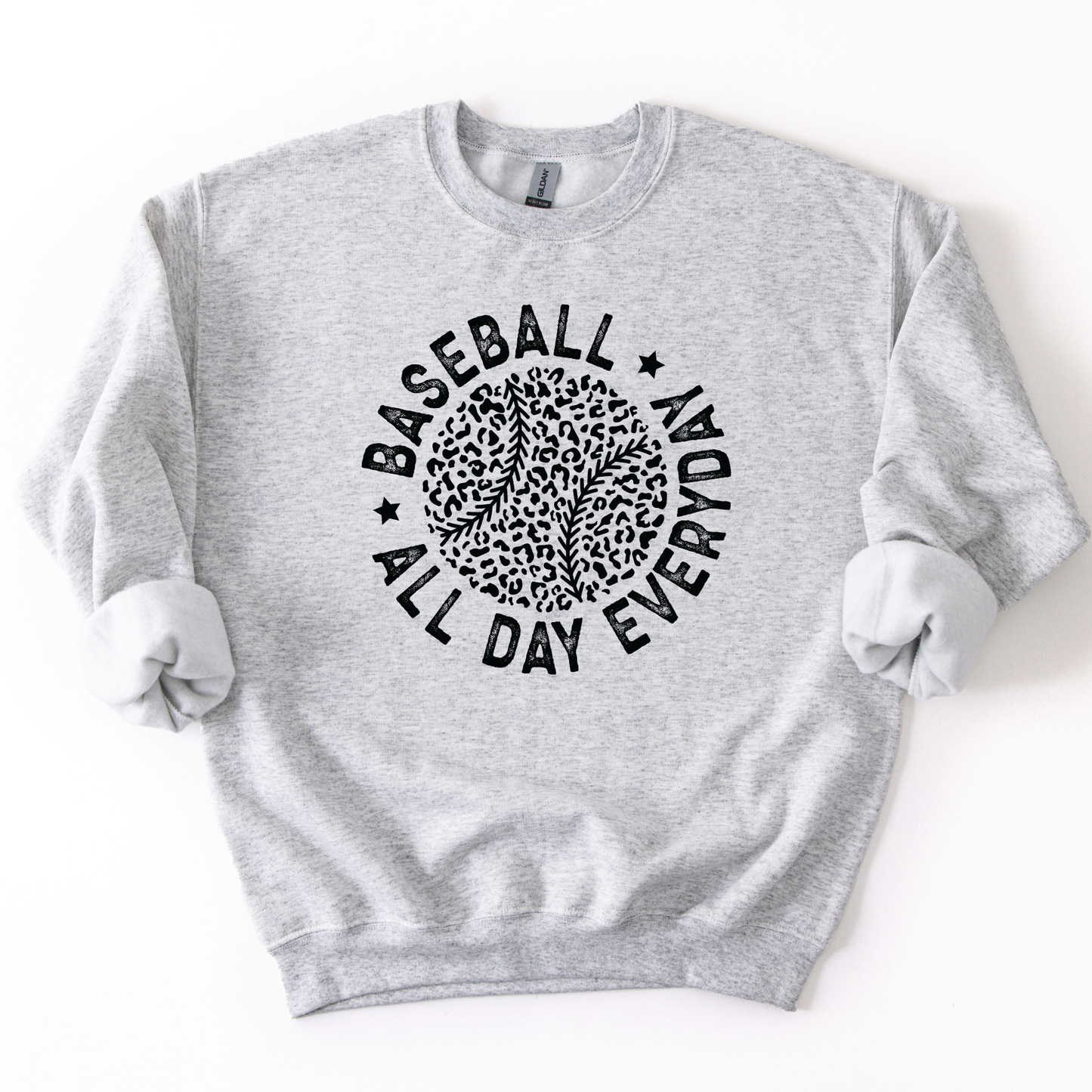 Ash gray crewneck sweatshirt featuring a black circular graphic with a leopard print baseball and curved text reading “Baseball All Day Everyday,” styled flat with sleeves scrunched on a white background.