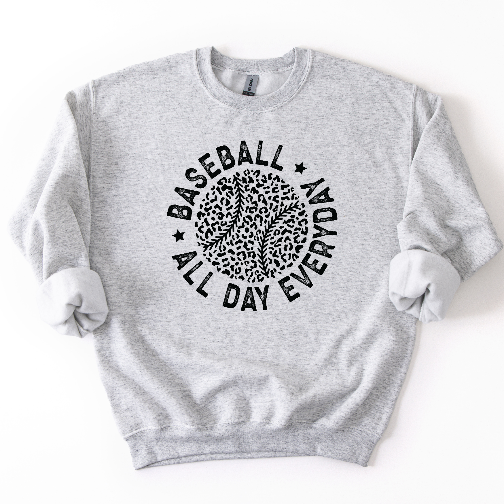 Ash gray crewneck sweatshirt featuring a black circular graphic with a leopard print baseball and curved text reading “Baseball All Day Everyday,” styled flat with sleeves scrunched on a white background.