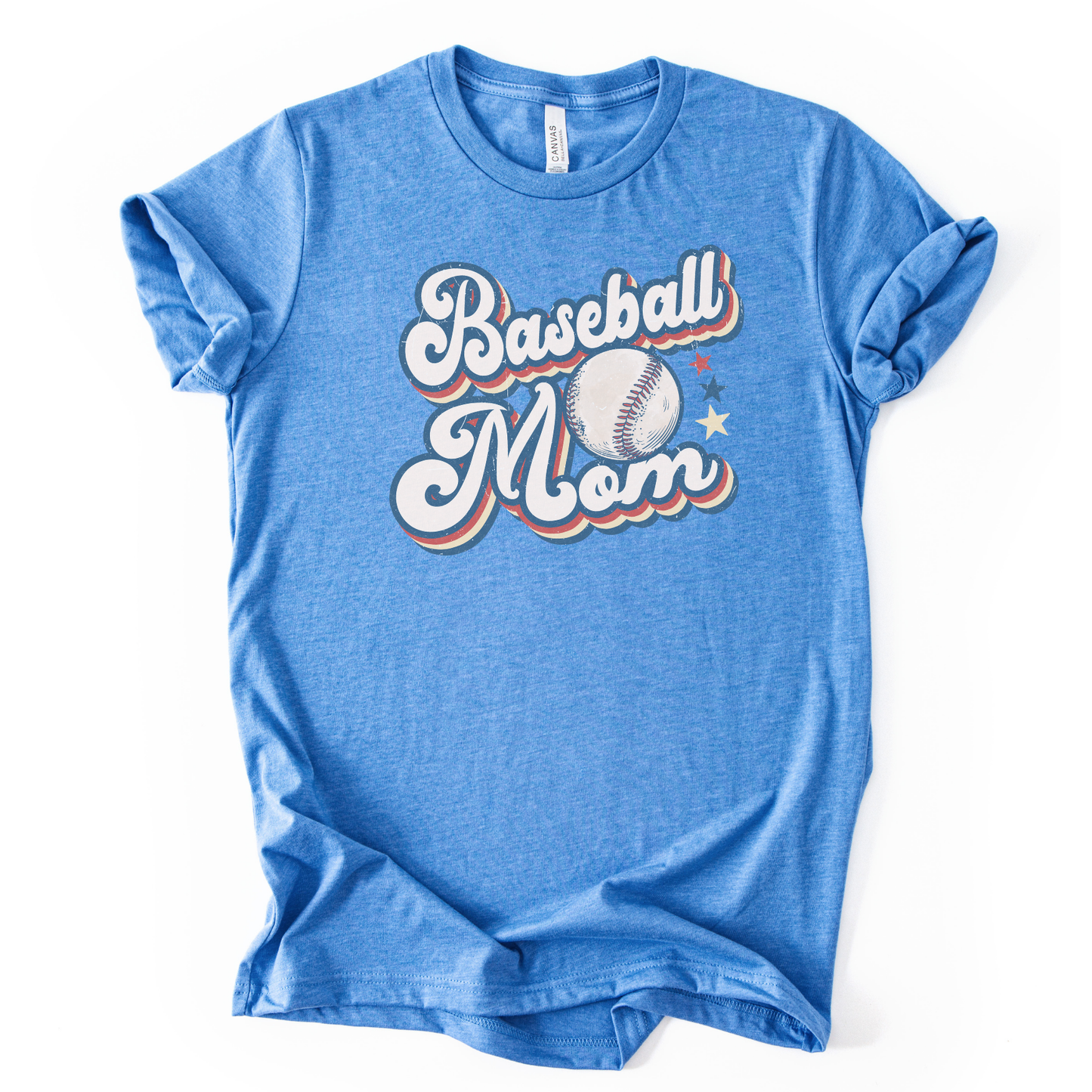 Heather columbia blue graphic t-shirt with retro-style “Baseball Mom” lettering, baseball graphic, and star accents, laid flat with rolled sleeves.