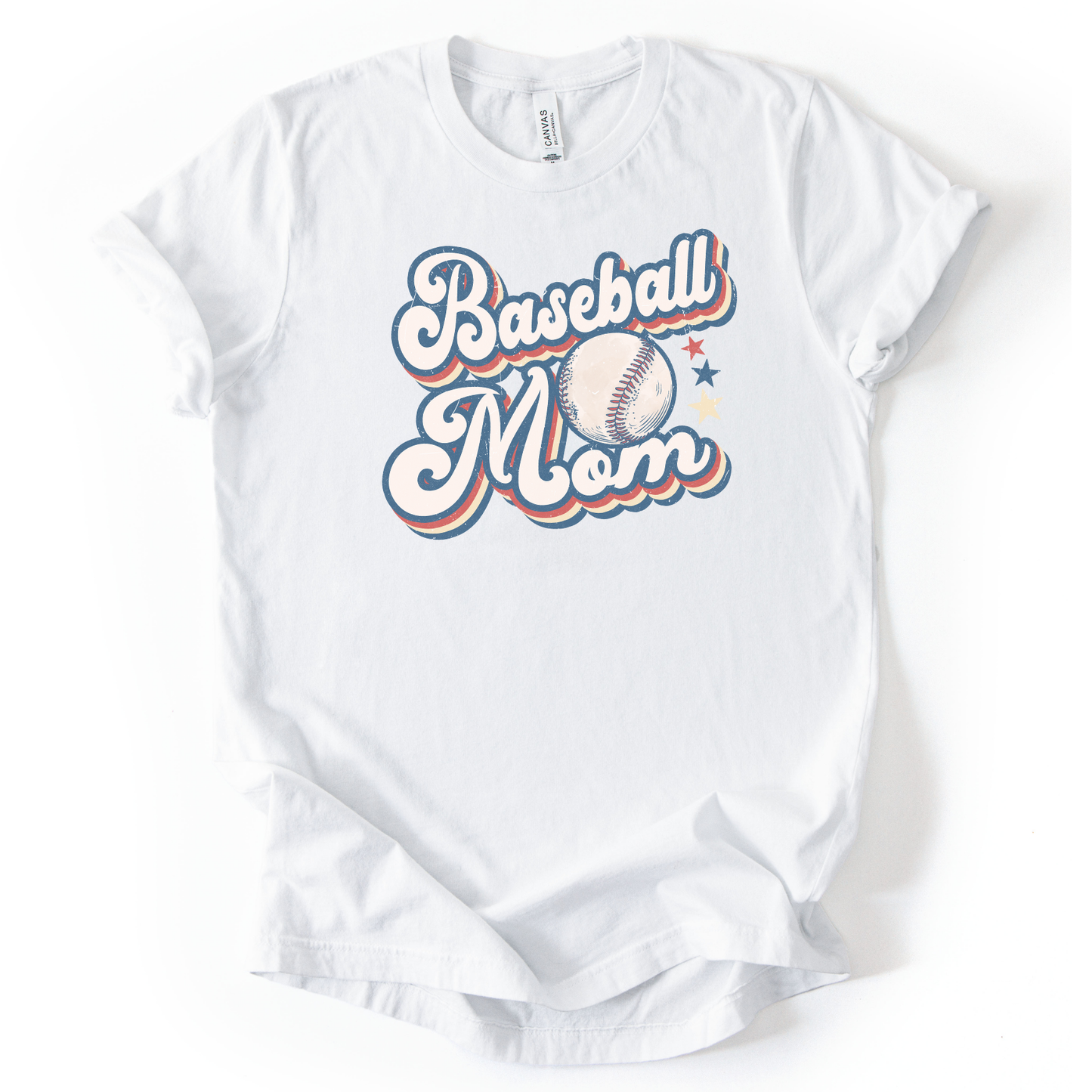 Solid white blend graphic t-shirt with retro-style “Baseball Mom” lettering, baseball graphic, and star accents, laid flat with rolled sleeves.