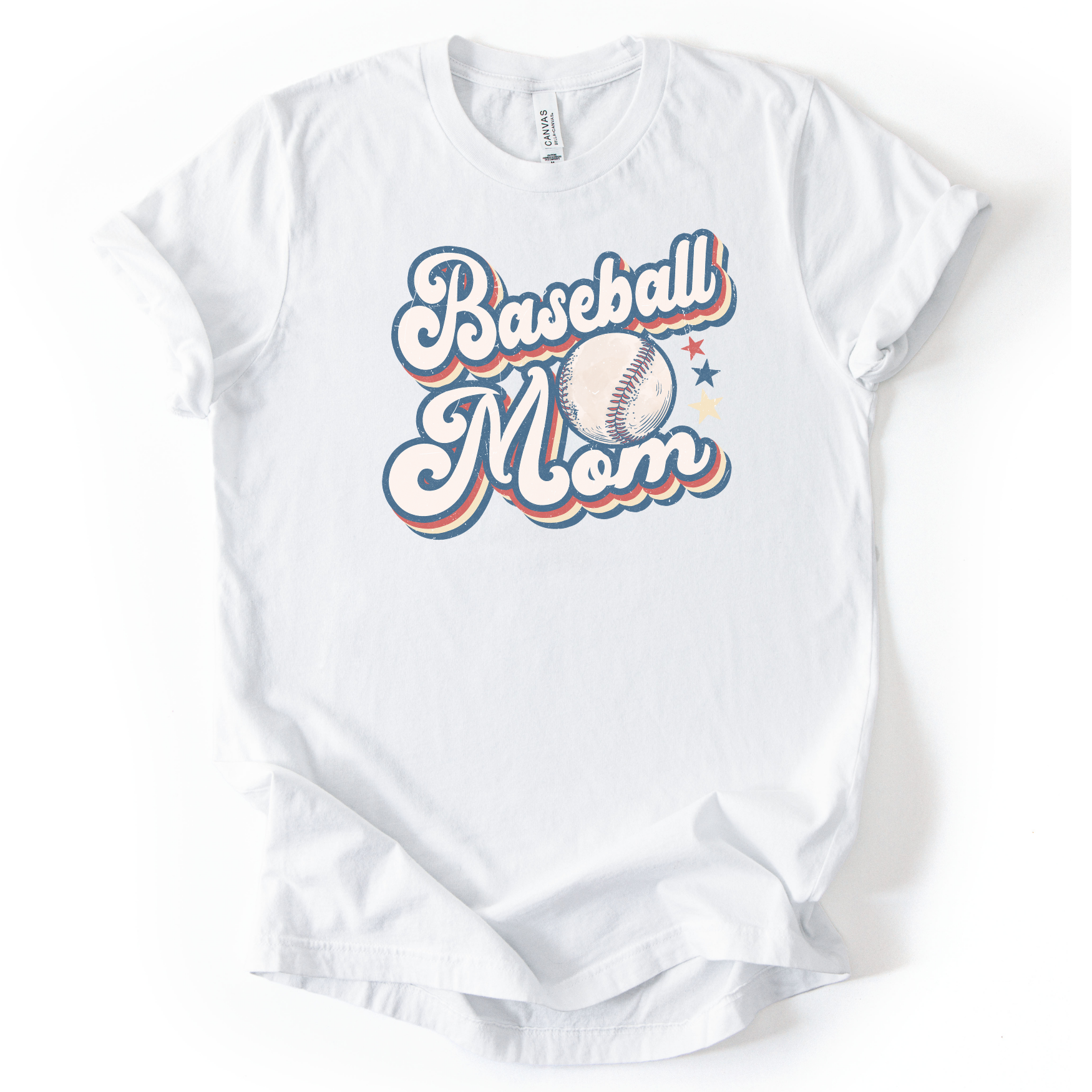 Solid white blend graphic t-shirt with retro-style “Baseball Mom” lettering, baseball graphic, and star accents, laid flat with rolled sleeves.