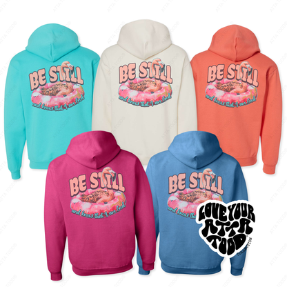 Five hoodies in different colors with a common design on the back, featuring text and graphics.