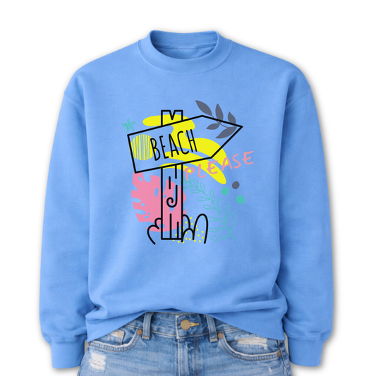 Beach themed graphic on a classic blue crewneck sweatshirt. The design features a stylized beach direction sign with the word Beach centered inside the arrow, surrounded by colorful coastal inspired shapes and decorative elements. The phrase Beach Please is incorporated into the graphic, creating a playful vacation themed design with bright tropical accents.
