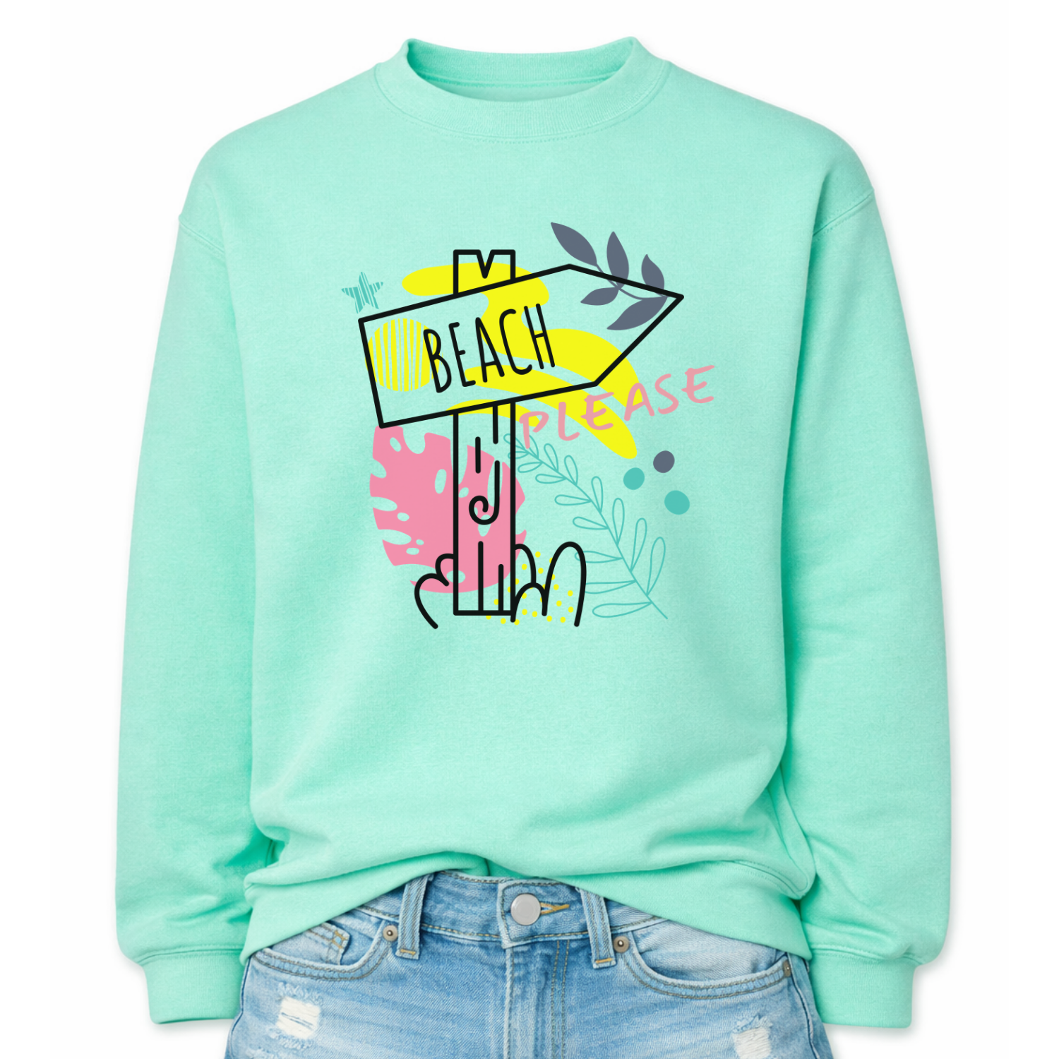 Beach themed graphic on a classic mint green crewneck sweatshirt. The design features a stylized beach direction sign with the word Beach centered inside the arrow, surrounded by colorful coastal inspired shapes and decorative elements. The phrase Beach Please is incorporated into the graphic, creating a playful vacation themed design with bright tropical accents.