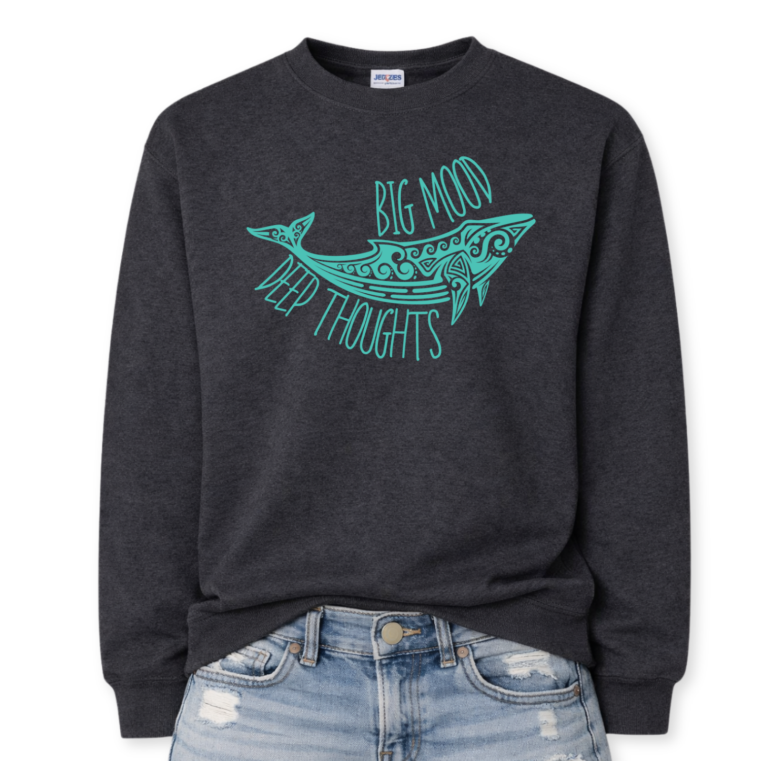 Heather black Coastal ocean themed graphic on a heather black classic crewneck sweatshirt. The design features a large decorative whale illustration filled with detailed swirl and sea life pattern elements. The phrase Big Mood Deep Thoughts is incorporated into the artwork with curved lettering that follows the whale shape, creating a balanced ocean inspired layout.