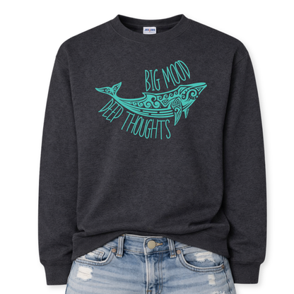 Heather black Coastal ocean themed graphic on a heather black classic crewneck sweatshirt. The design features a large decorative whale illustration filled with detailed swirl and sea life pattern elements. The phrase Big Mood Deep Thoughts is incorporated into the artwork with curved lettering that follows the whale shape, creating a balanced ocean inspired layout.