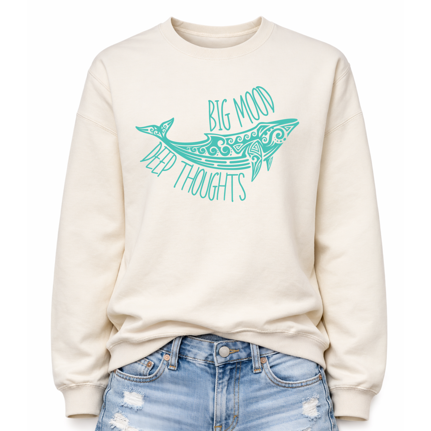 Sweet cream ivory color Coastal ocean themed graphic on a classic off white crewneck sweatshirt. The design features a large decorative whale illustration filled with detailed swirl and sea life pattern elements. The phrase Big Mood Deep Thoughts is incorporated into the artwork with curved lettering that follows the whale shape, creating a balanced ocean inspired layout.