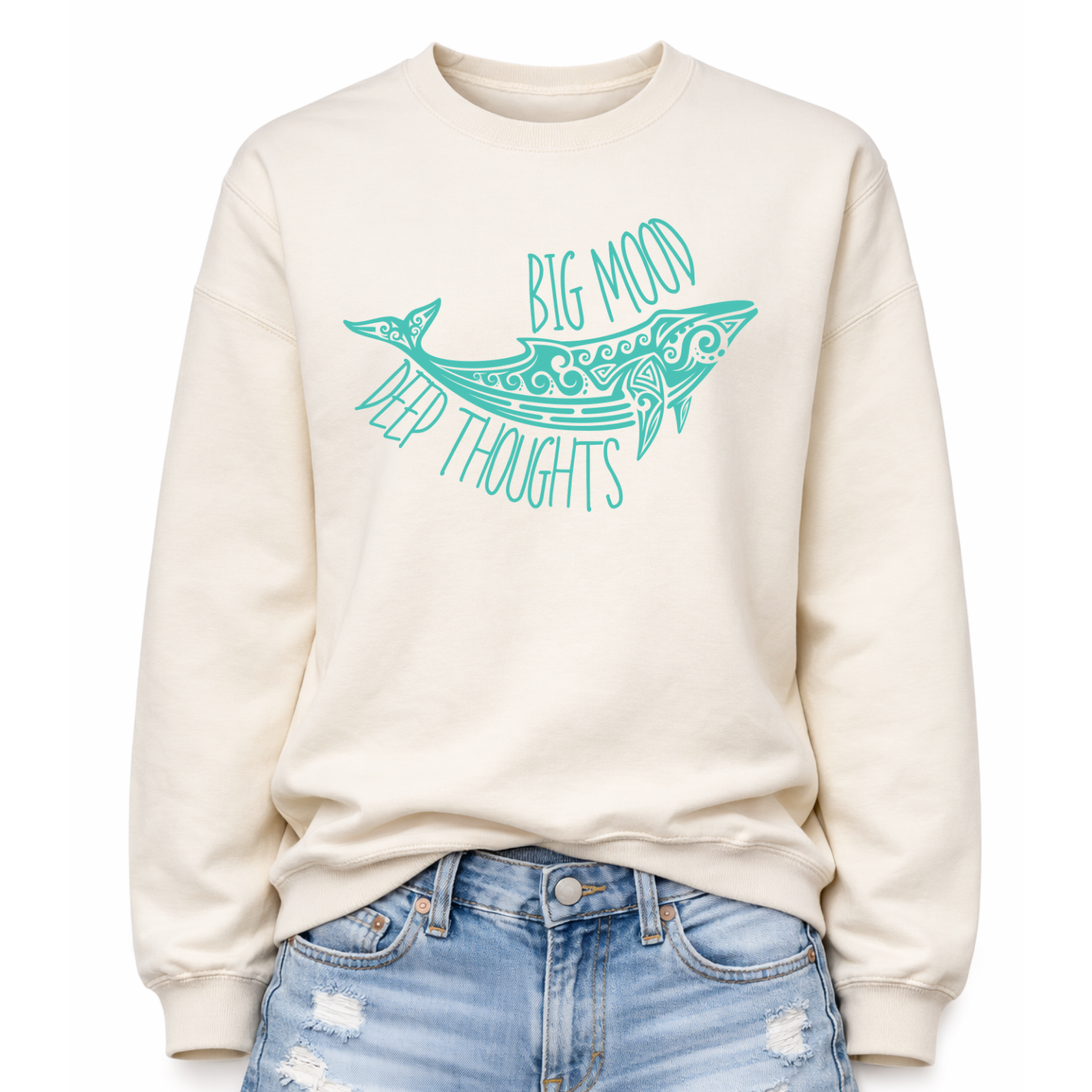 Sweet cream ivory color Coastal ocean themed graphic on a classic off white crewneck sweatshirt. The design features a large decorative whale illustration filled with detailed swirl and sea life pattern elements. The phrase Big Mood Deep Thoughts is incorporated into the artwork with curved lettering that follows the whale shape, creating a balanced ocean inspired layout.