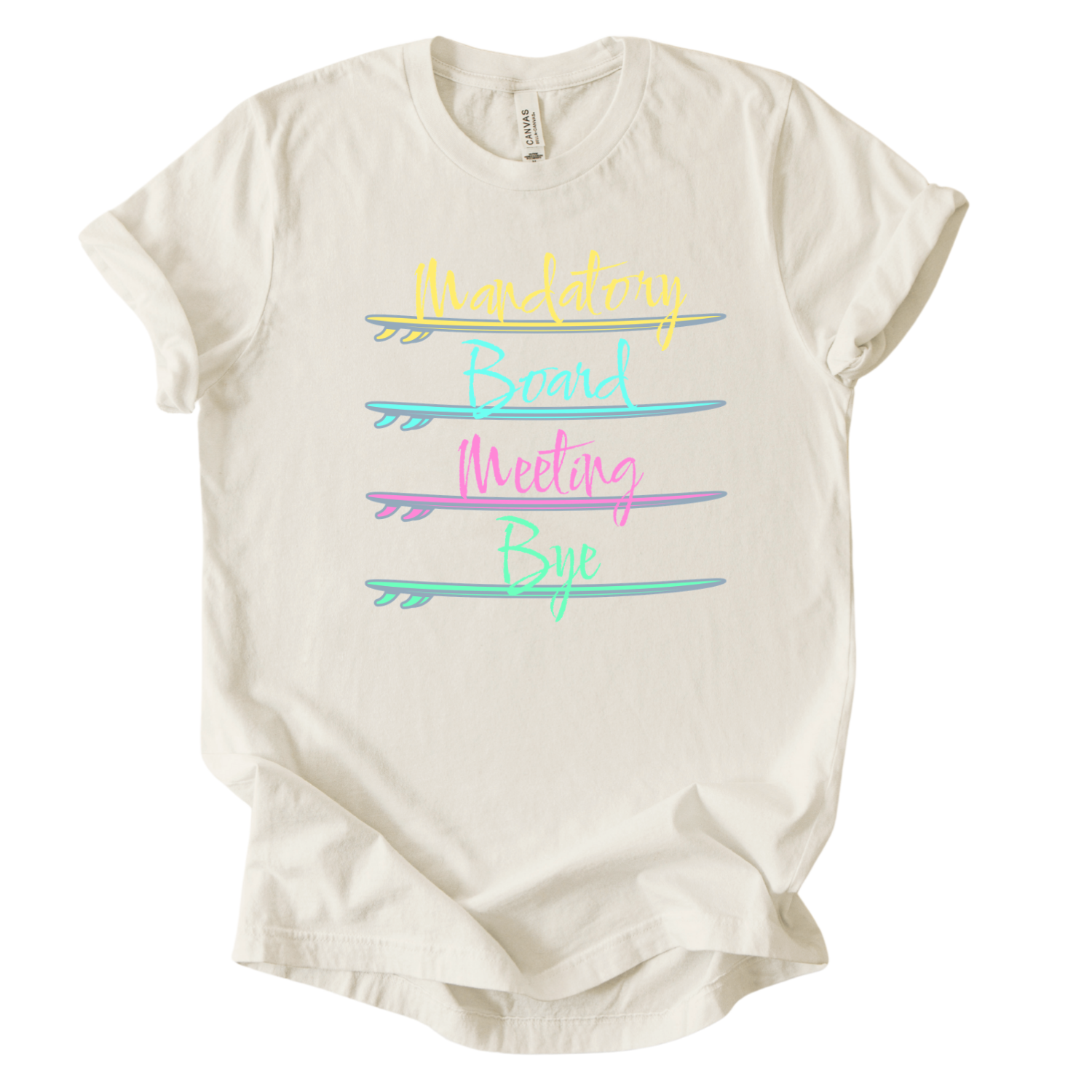 Surf themed beach graphic on a soft heather oatmeal unisex graphic tee. The design features the phrase Mandatory Board Meeting Bye displayed across four stacked surfboards in bright summer colors including yellow, aqua, pink, and seafoam green. A lighthearted beach humor graphic that captures the feeling of skipping work for ocean time.
