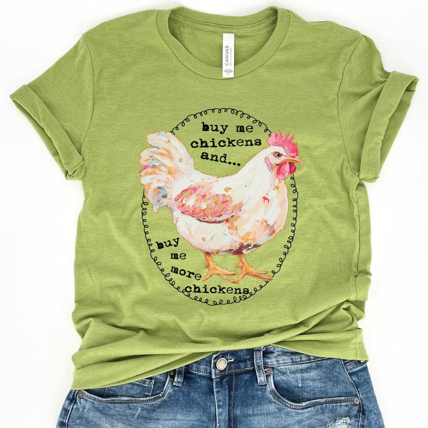 Buy me chickens and buy me more chickens on a heather green bella canvas tshirt featuring a white chicken
