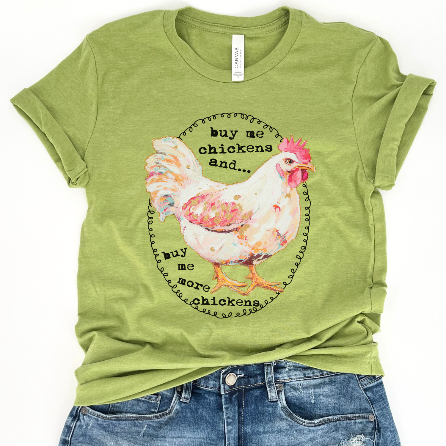 Green t-shirt with a chicken graphic and text on a white background.  Buy me chickens and...buy me more chickens.