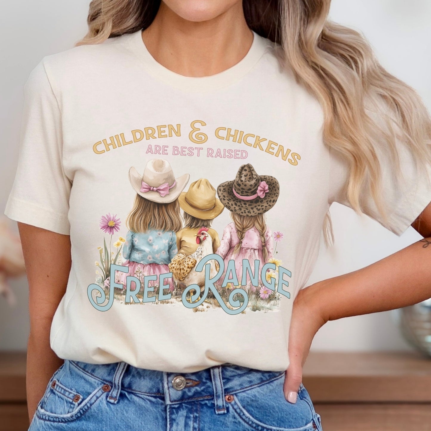 Children and chickens are best raised free range featuring 3 cute kids with a chicken in a flower field. on a heather oatmeal  t-shirt