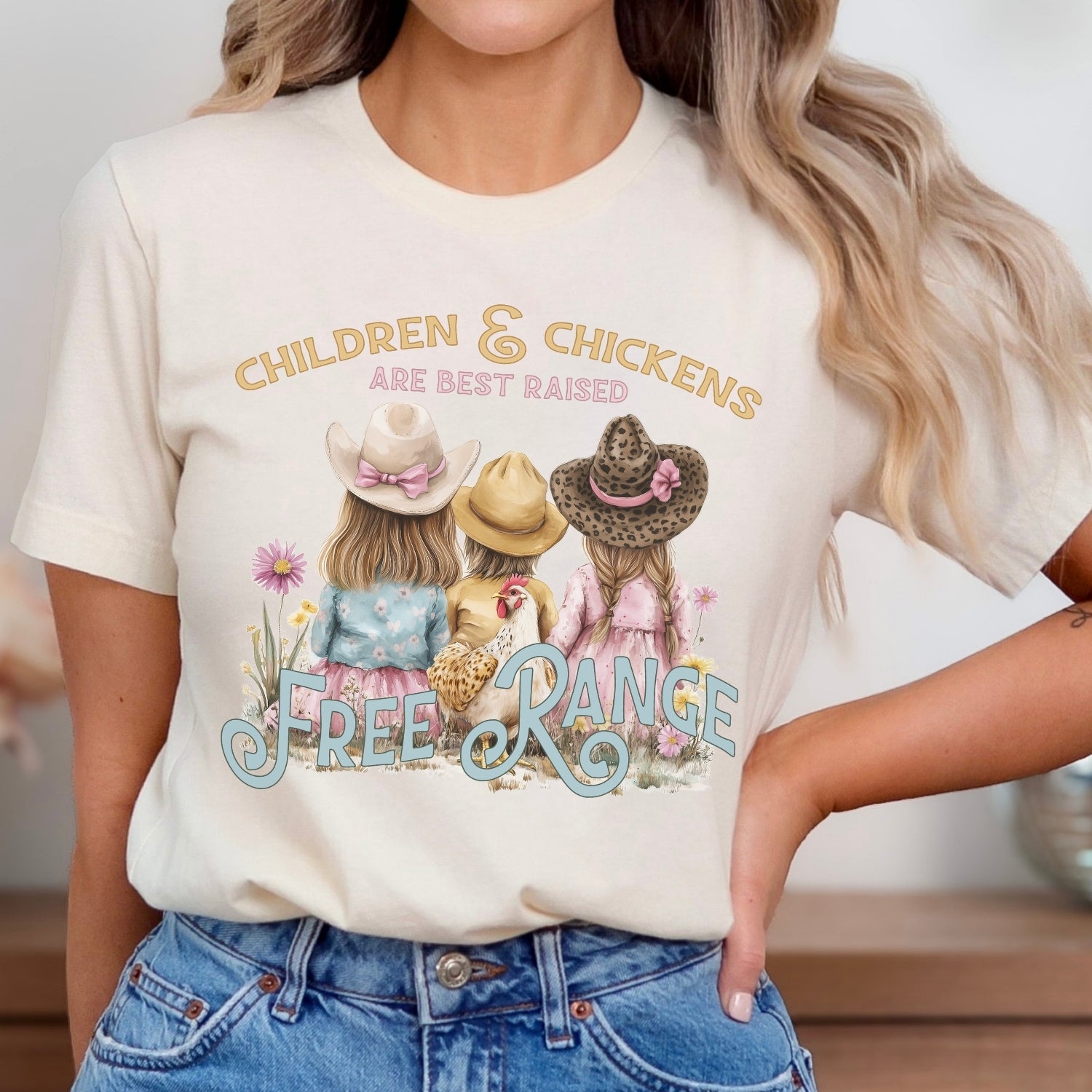 Children and chickens are best raised free range featuring 3 cute kids with a chicken in a flower field. on a heather oatmeal  t-shirt