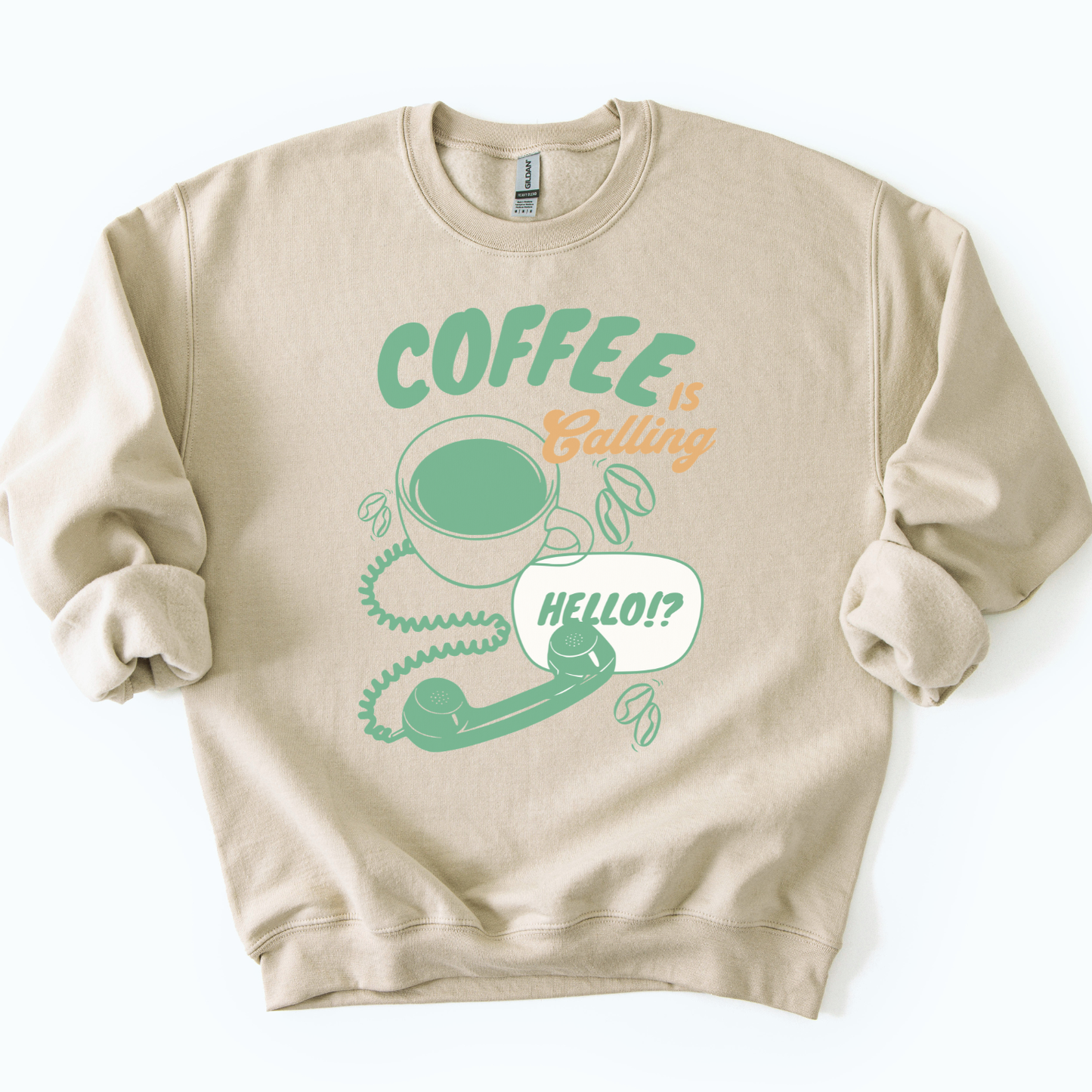 Coffee is calling funny graphic on a gildan sand color sweatshirt