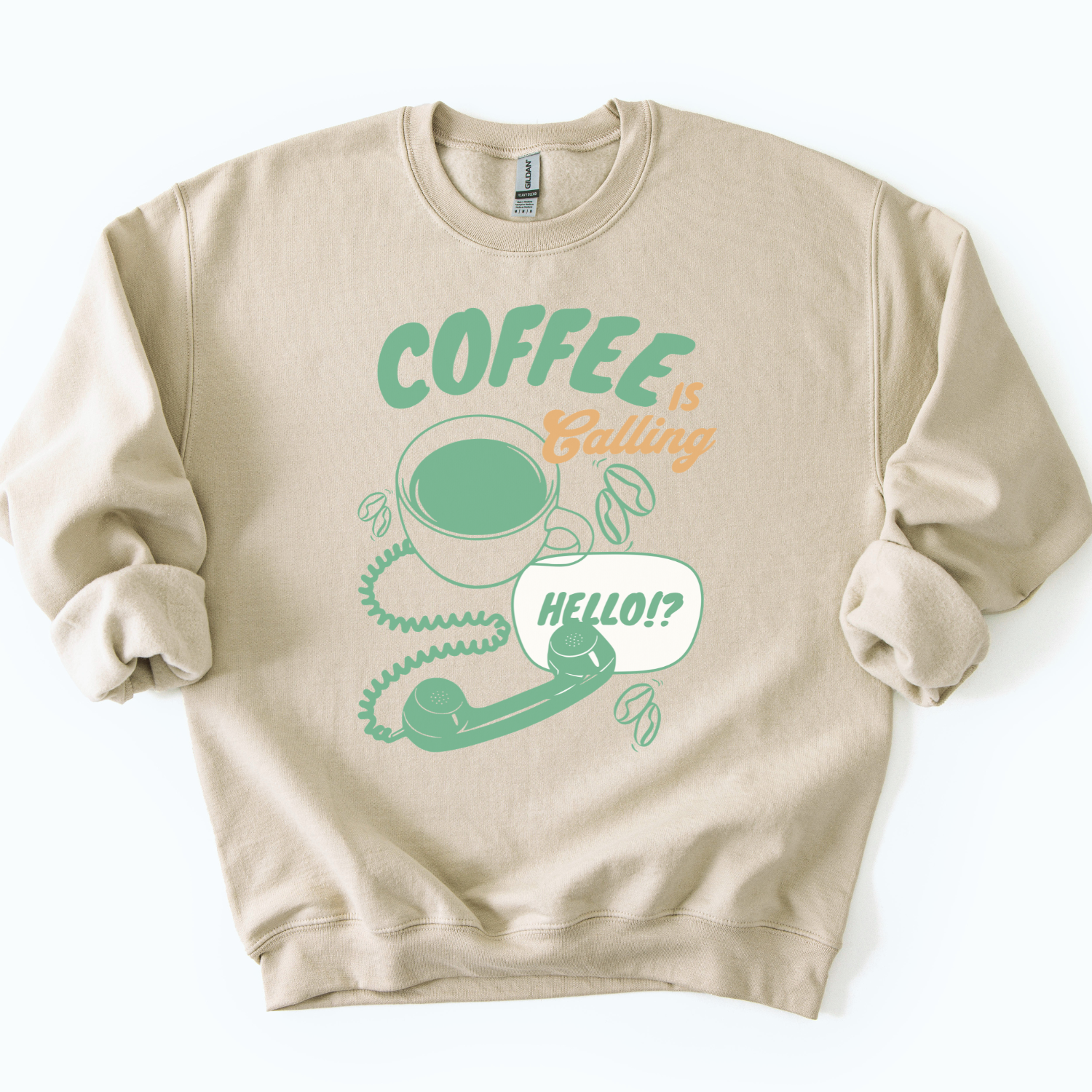 Coffee is calling funny graphic on a gildan sand color sweatshirt