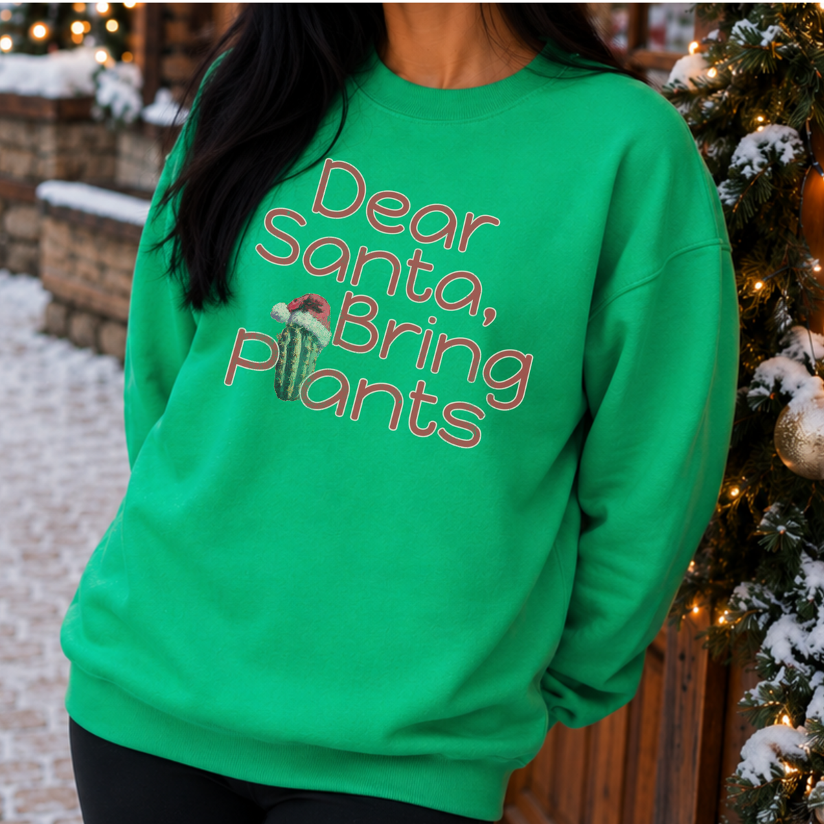 Dear Santa Bring Plants featuring a cactus wearing a santa's hat on an Irish Green sweatshirt