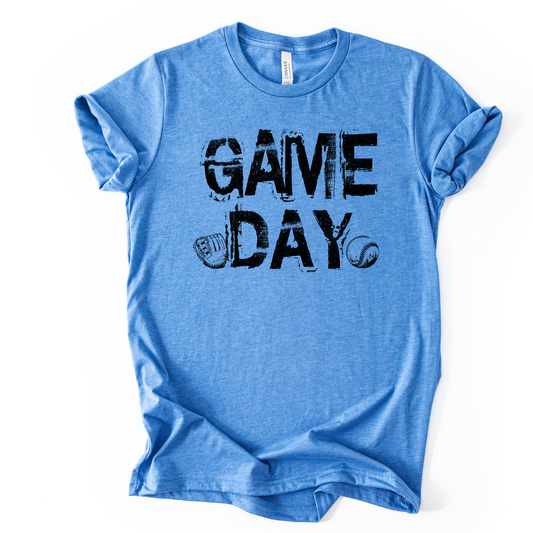 Heather columbia blue graphic t-shirt with distressed black “GAME DAY” text and small baseball glove and baseball icons, laid flat with rolled sleeves.