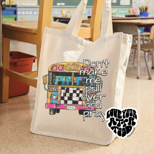 Jumbo canvas tote bag with vintage school bus graphic and “Don’t Make Me Pull Over and Pray” faith humor message, painted texture look, Love your ATTA TOOD® brand mark, printed on both sides.