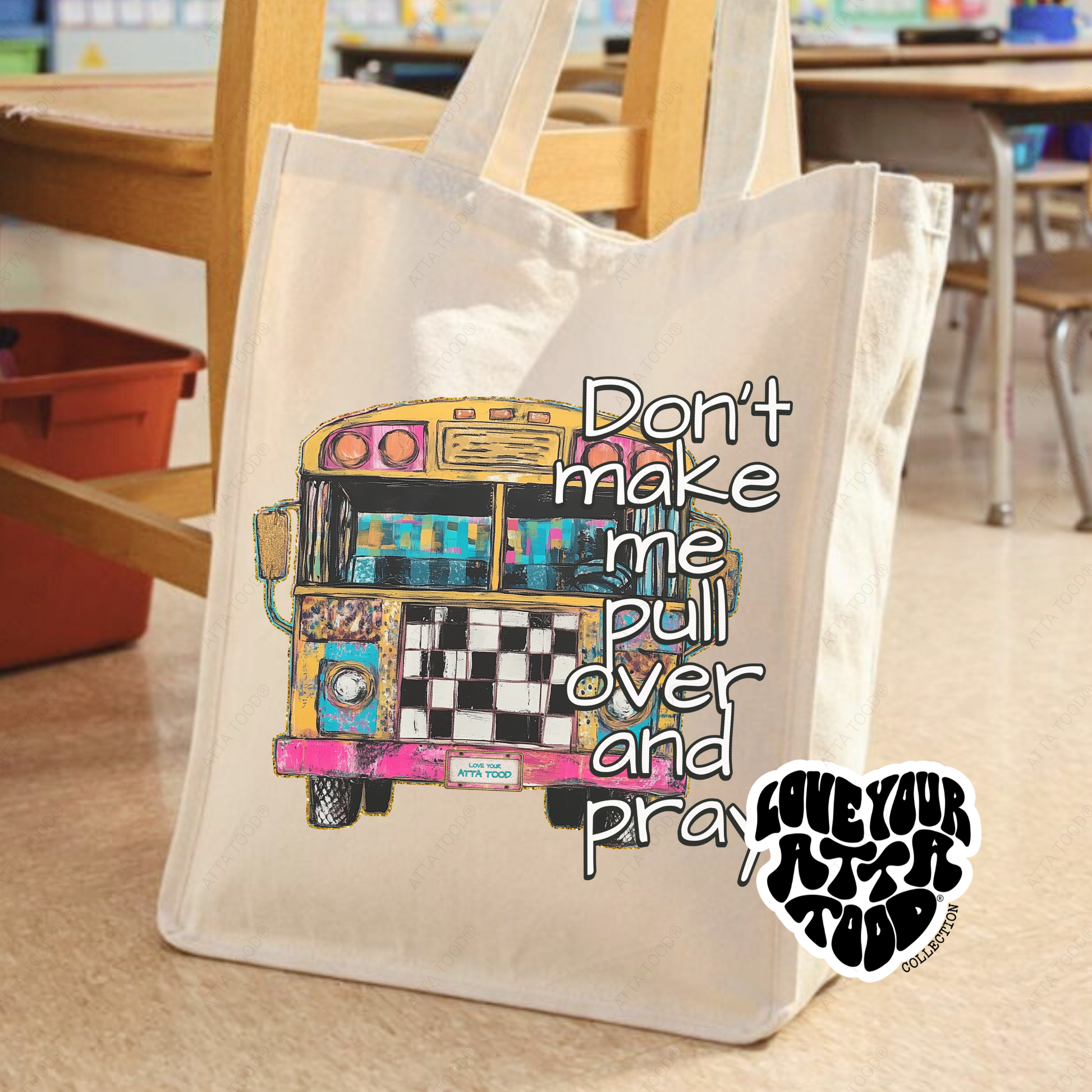 Tote bag with a colorful bus illustration and text in a classroom setting