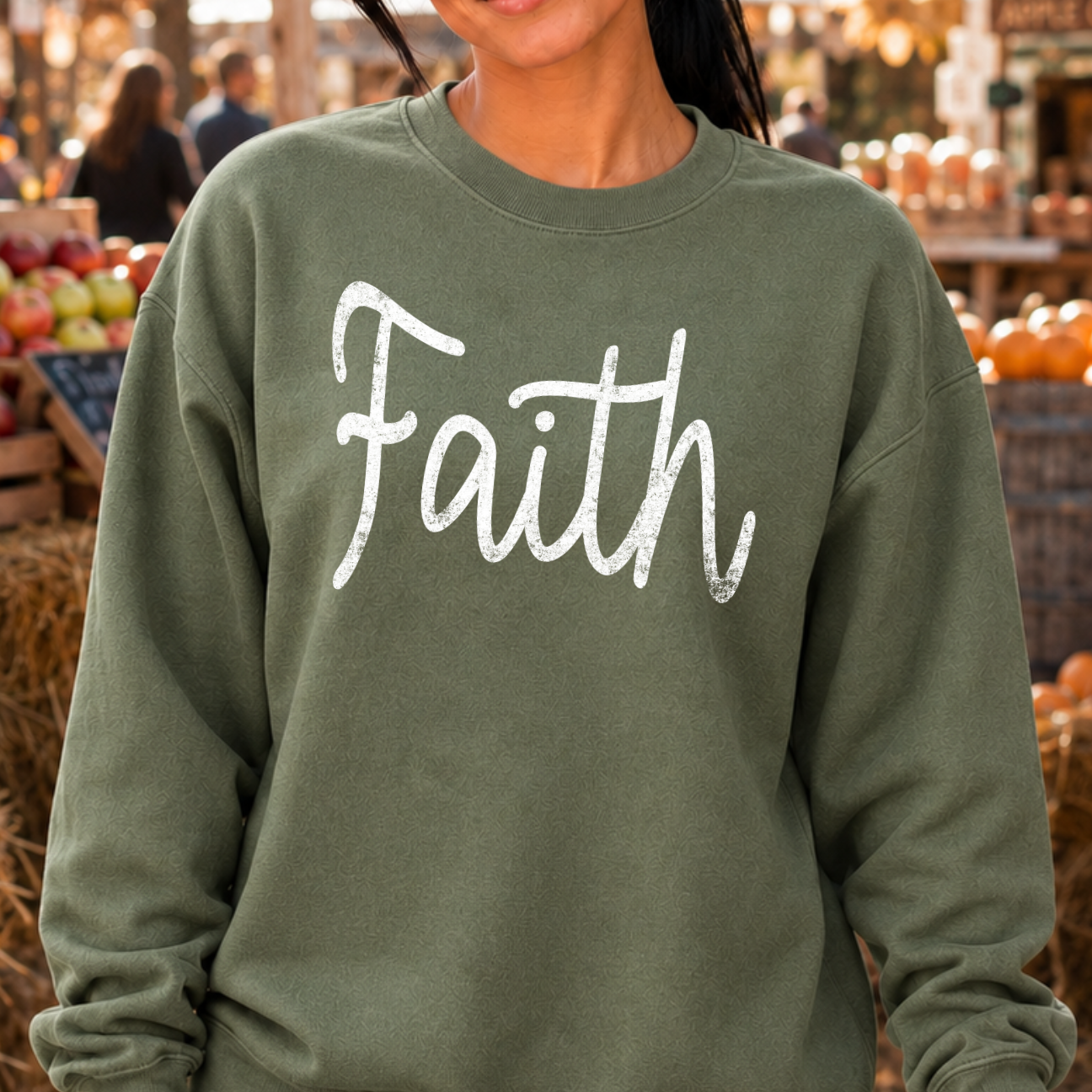 Faith on a military green sweatshirt