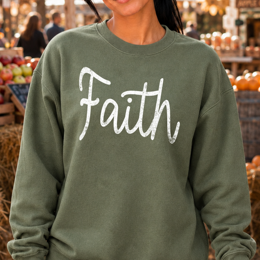 Faith on a military green sweatshirt