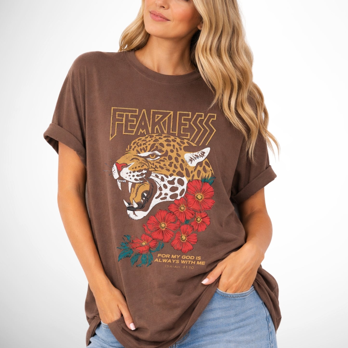 Woman wearing a brown t-shirt with a leopard graphic and 'FEARLESS' text on a white background.  Fearless for my God is always with me Isaiah 41:10