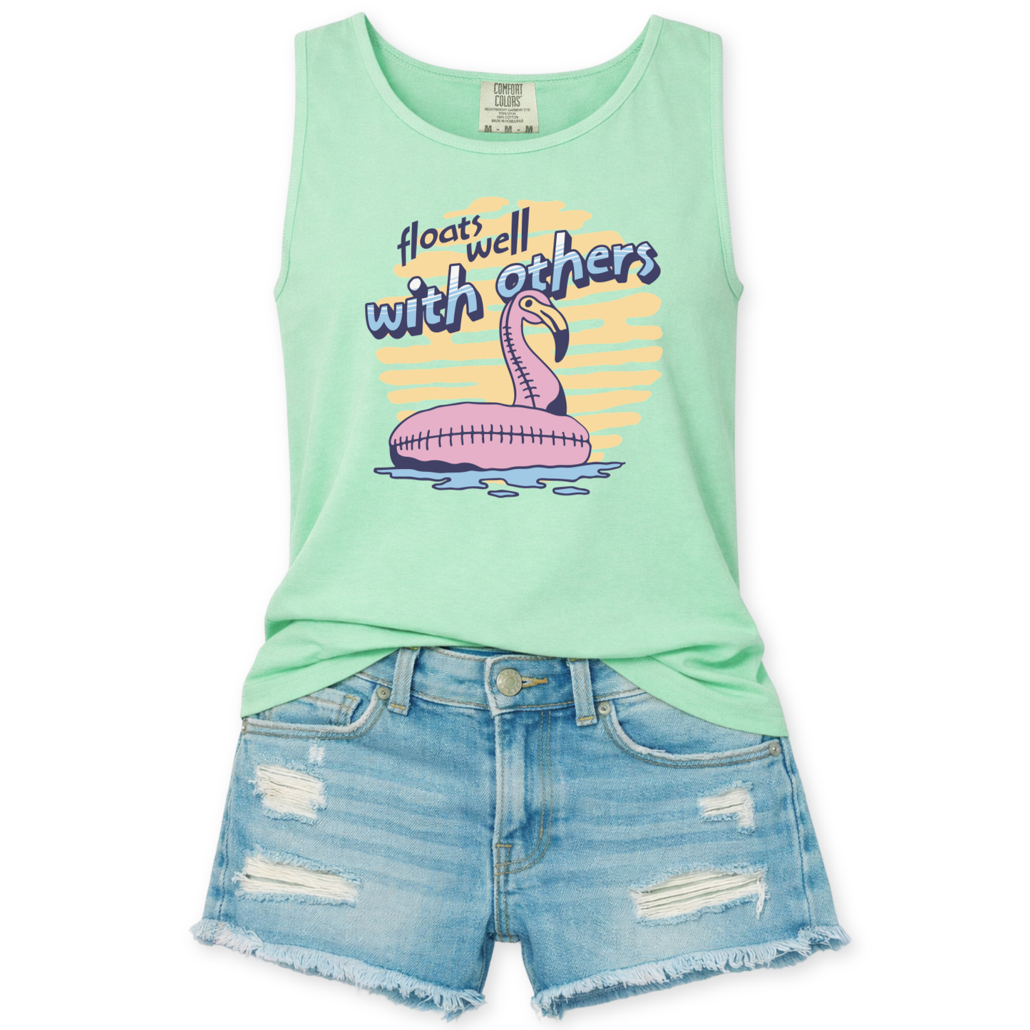 mint green tank top with a flamingo floaty graphic design that says floats well with others.