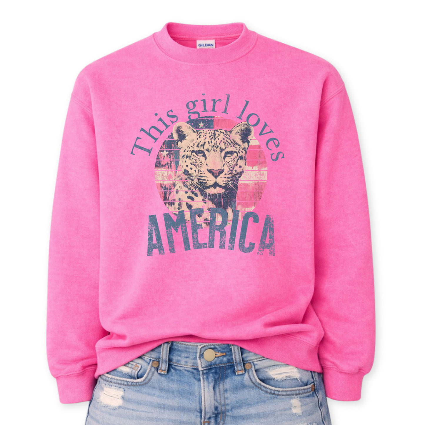 Pink sweatshirt with leopard graphic and 'This girl loves America' text on a white background