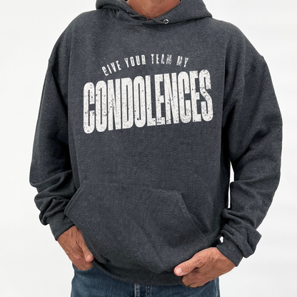 Person wearing a dark gray hoodie with text 'GIVE YOUR TEAM MY CONDOLENCES' on a white background