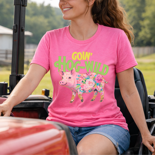 Goin hog wild featuring a floral pig on a bella canvas heather charity pink t-shirt