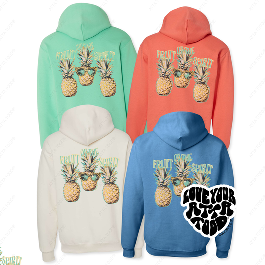 Four hoodies in different colors with pineapple graphics and text on a white background.  fruit of the spirit