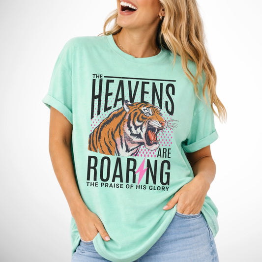 The heavens are roaring the praise of His glory tiger graphic on a comfort colors island reef green tee