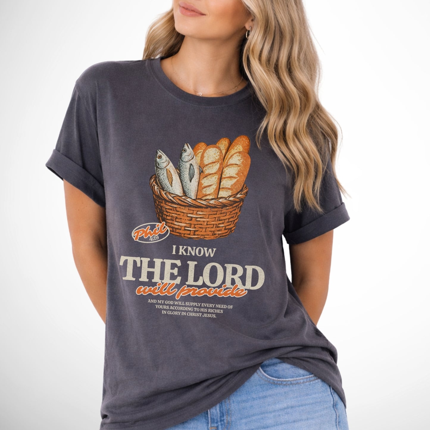 I know the Lord will provide featuring a basket of bread and fish referencing bible verse Philipians 4:19.  pepper gray tee
