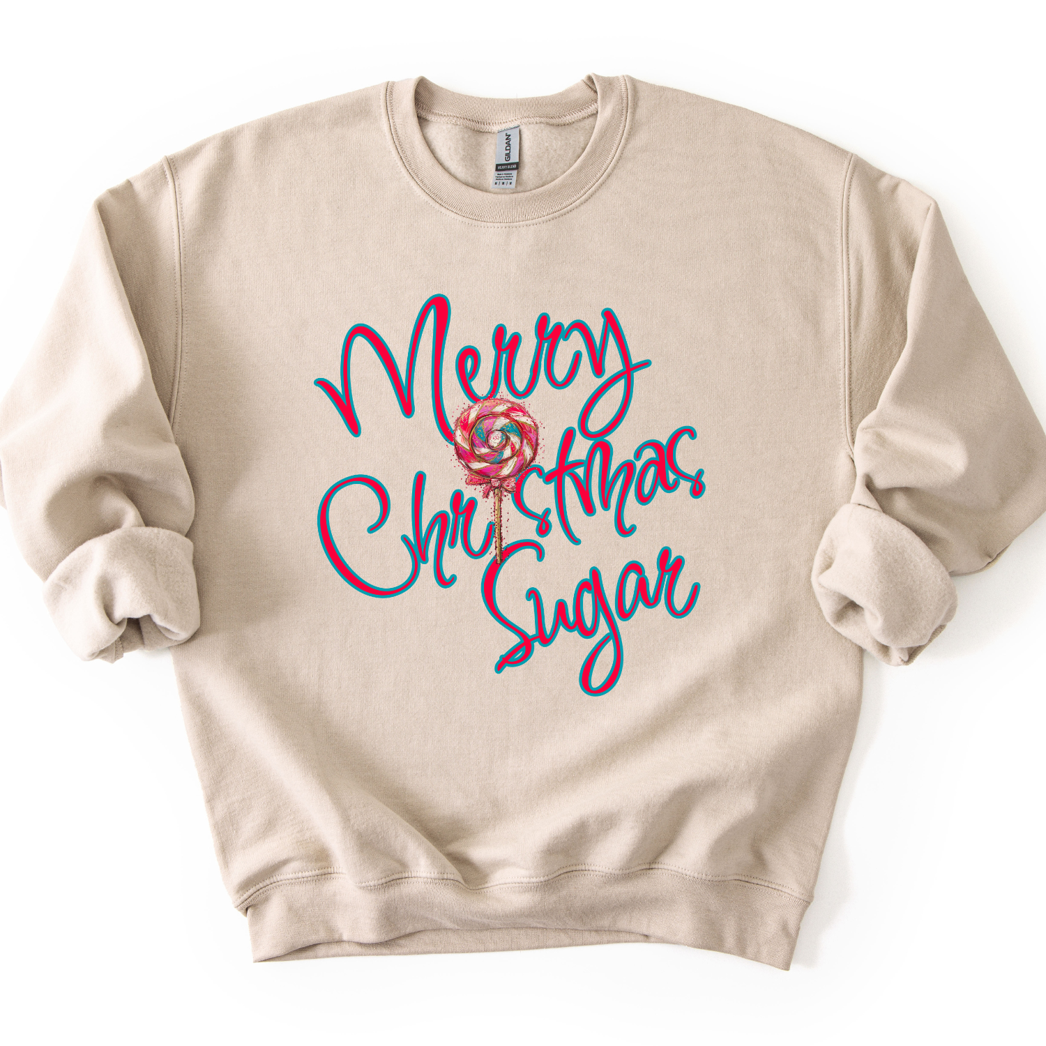 A beige crewneck sweatshirt featuring a colorful graphic on the front that reads 'Merry Christmas Sugar' in red and blue script with a lollipop illustration in the center.