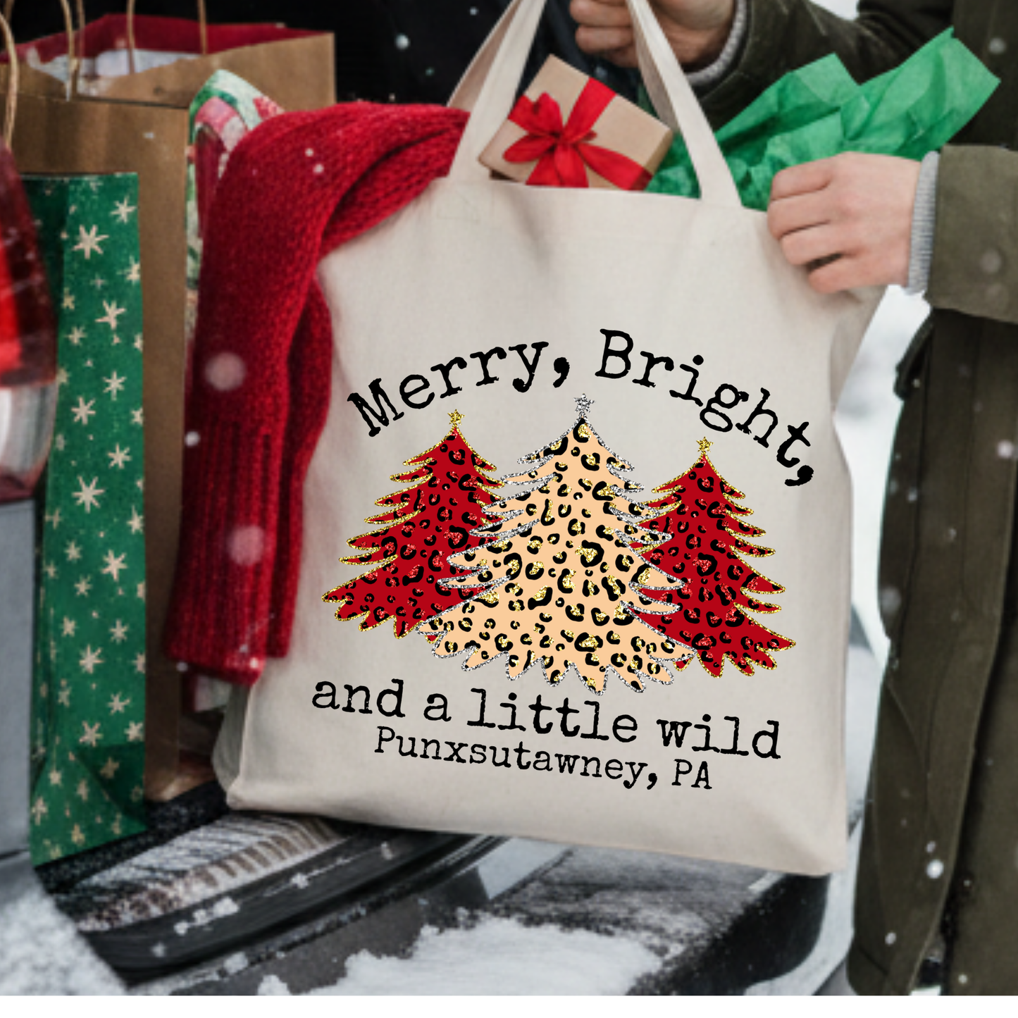 Canvas tote bag with 3 large leopard print Christmas trees that says Merry, bright and little wild.  Customizable tote with business name, city and state or both