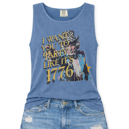 blue jean Comfort Colors tank top featuring a distressed vintage Uncle Sam graphic with the phrase “I Want You To Party Like It’s 1776” in layered gold and dark lettering, styled in a flat lay mockup with light wash denim jeans.