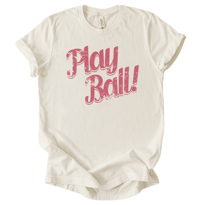 Cream t-shirt with 'Play Ball!' text in pink on a white background