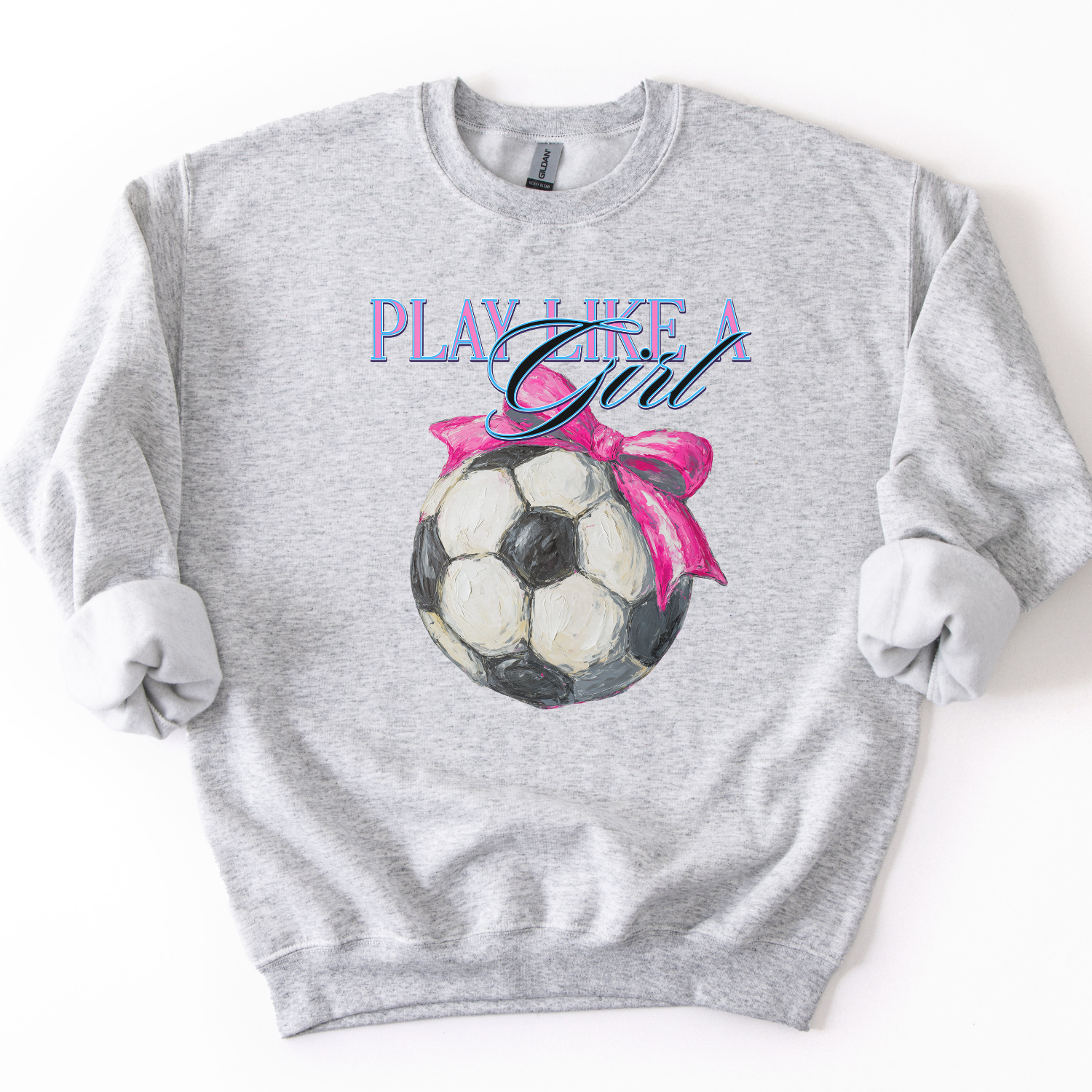 Play like a girl Soccer graphic with a pink bow on a gray sweatshirt