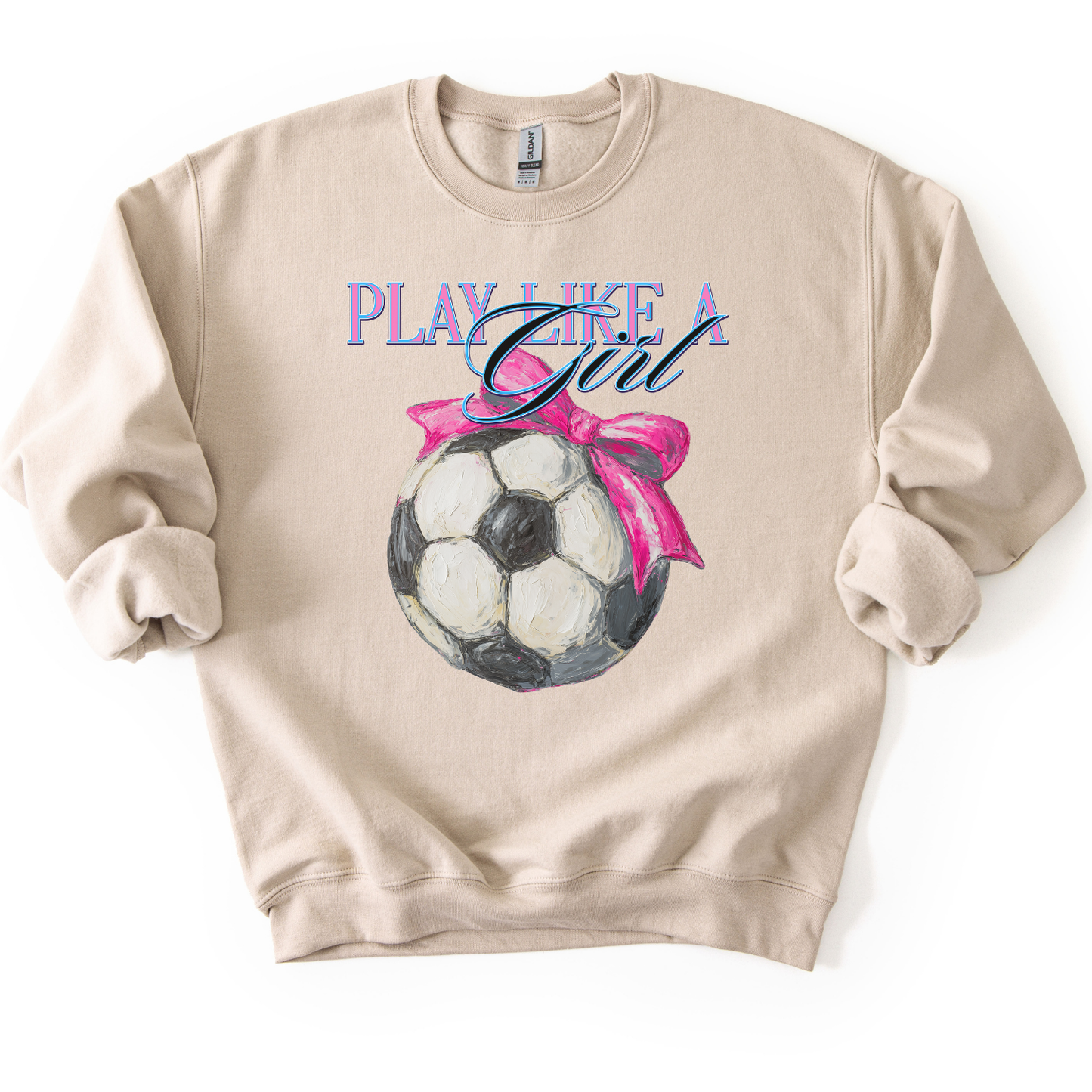Beige sweatshirt with soccer ball and pink bow design on a white background