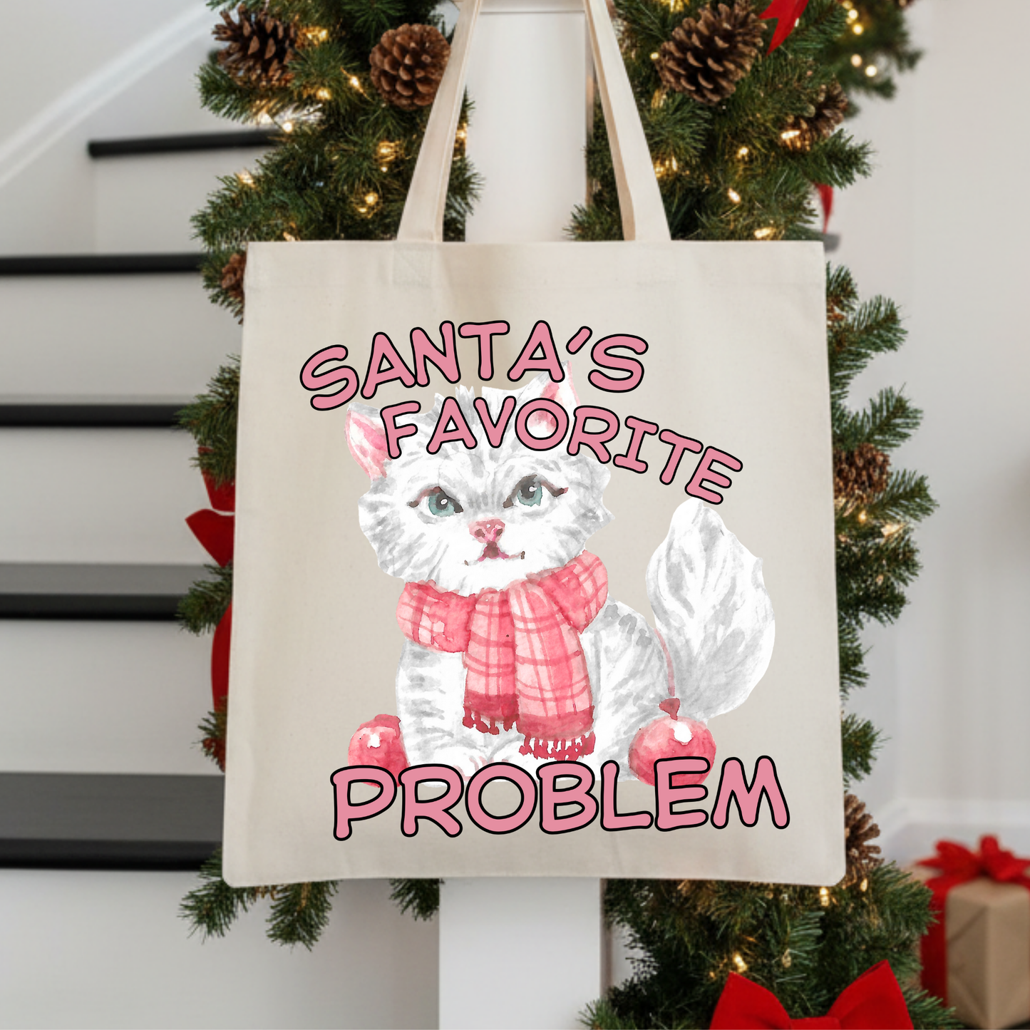 Tote bag with a cute white cat illustration and text 'Santa's Favorite Problem' 