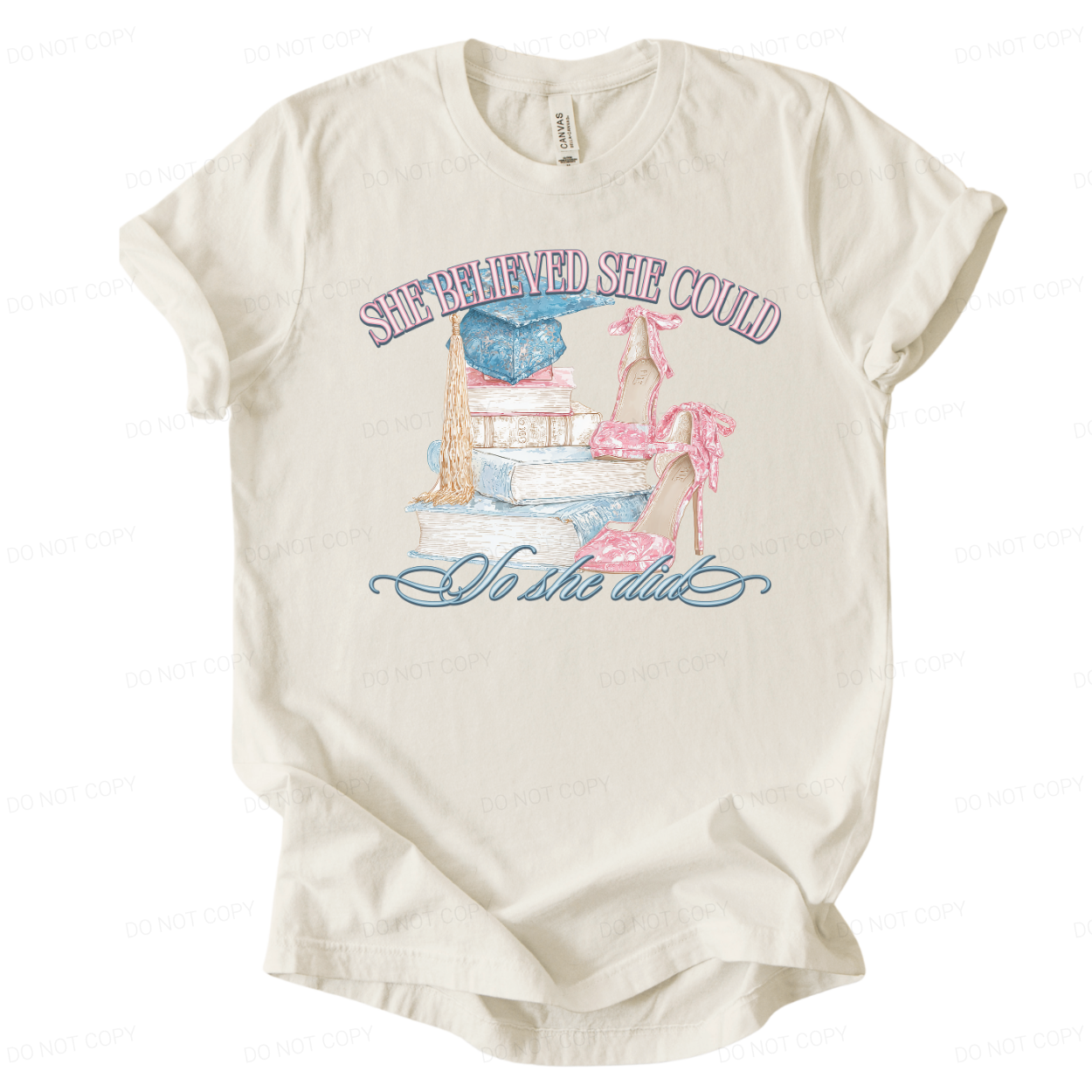 Graduation themed inspirational graphic t shirt. The design features a stacked book illustration topped with a blue graduation cap and long tassel, paired with pink high heel shoes tied with bows. The artwork reads She Believed She Could across the top and So She Did in script below, creating a soft academic graduation look with strong gift appeal.