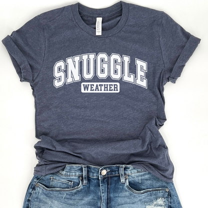 snuggle weather white graphic on a heather navy t-shirt