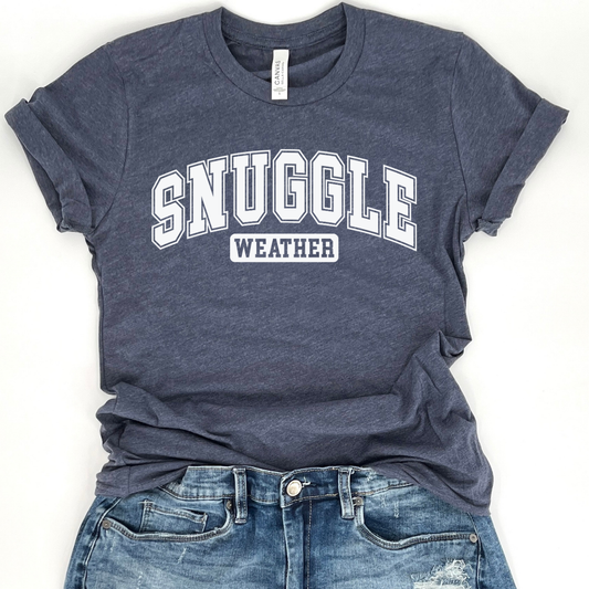 snuggle weather white graphic on a heather navy t-shirt