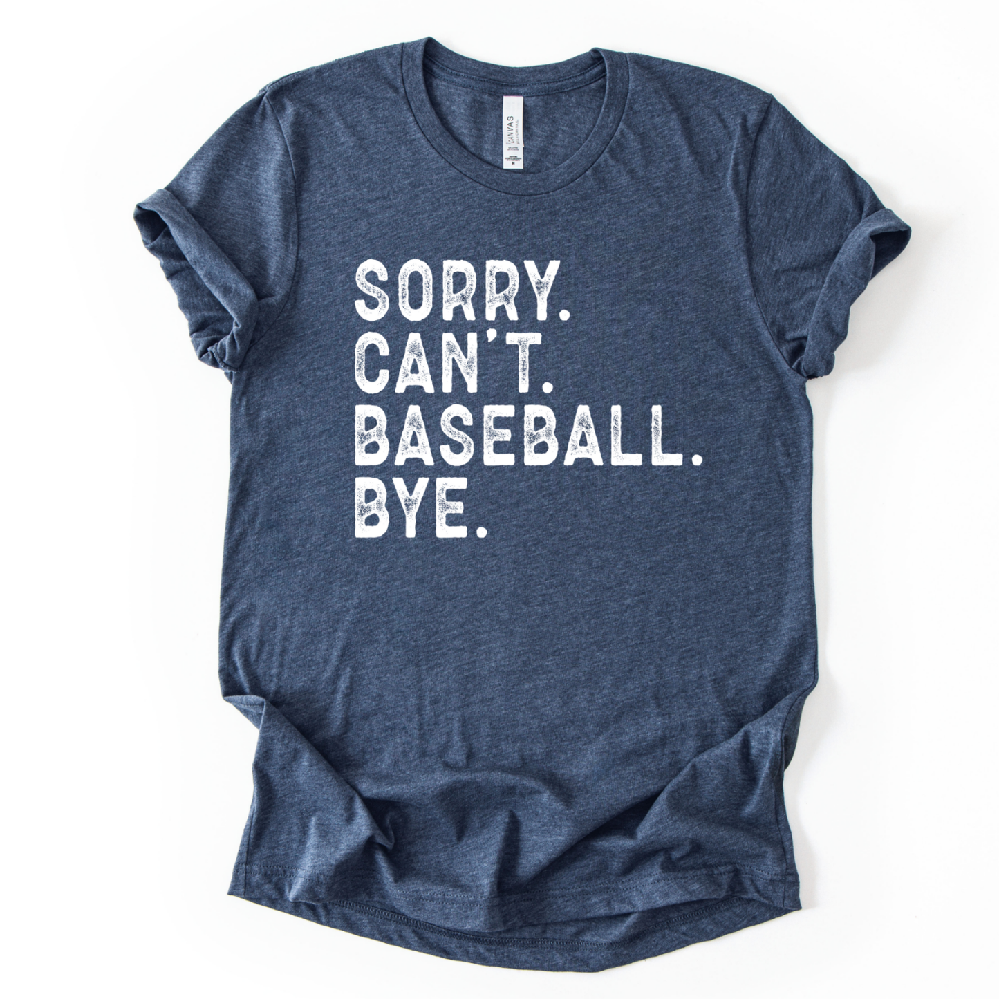 Blue t-shirt with white text 'Sorry. Can't. Baseball. Bye.' on a white background