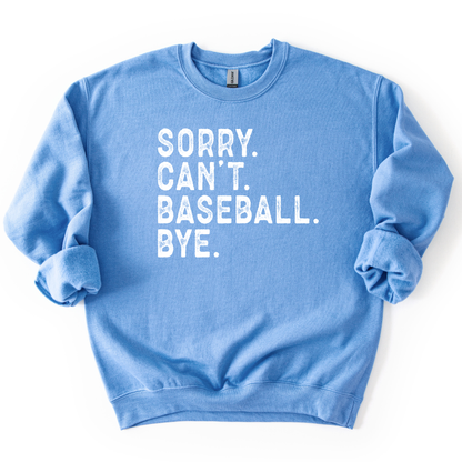 blue crewneck sweatshirt with distressed white text reading “SORRY. CAN’T. BASEBALL. BYE.” laid flat with sleeves slightly scrunched.