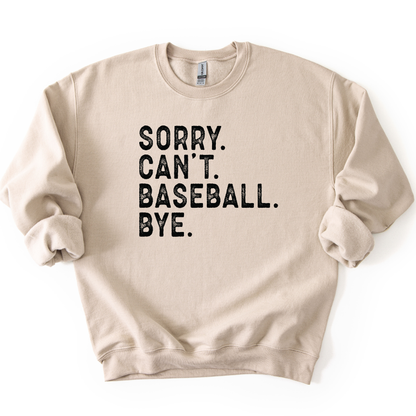 Beige sweatshirt with text 'SORRY. CAN'T. BASEBALL. BYE.' on a white background
