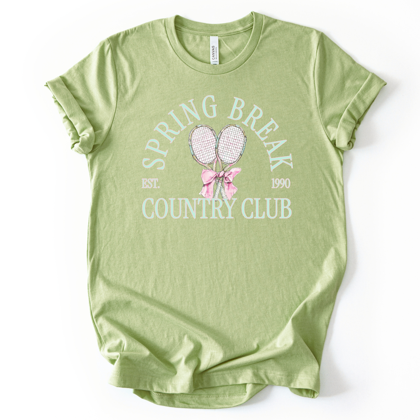 green t-shirt with 'Spring Break Country Club' text and graphics on a white background.The graphic features a pair of illustrated tennis rackets crossed at the handles and tied together with a soft pink ribbon bow at the center. Arched text reads “Spring Break Country Club”, with small accent details adding a classic, collegiate feel. 