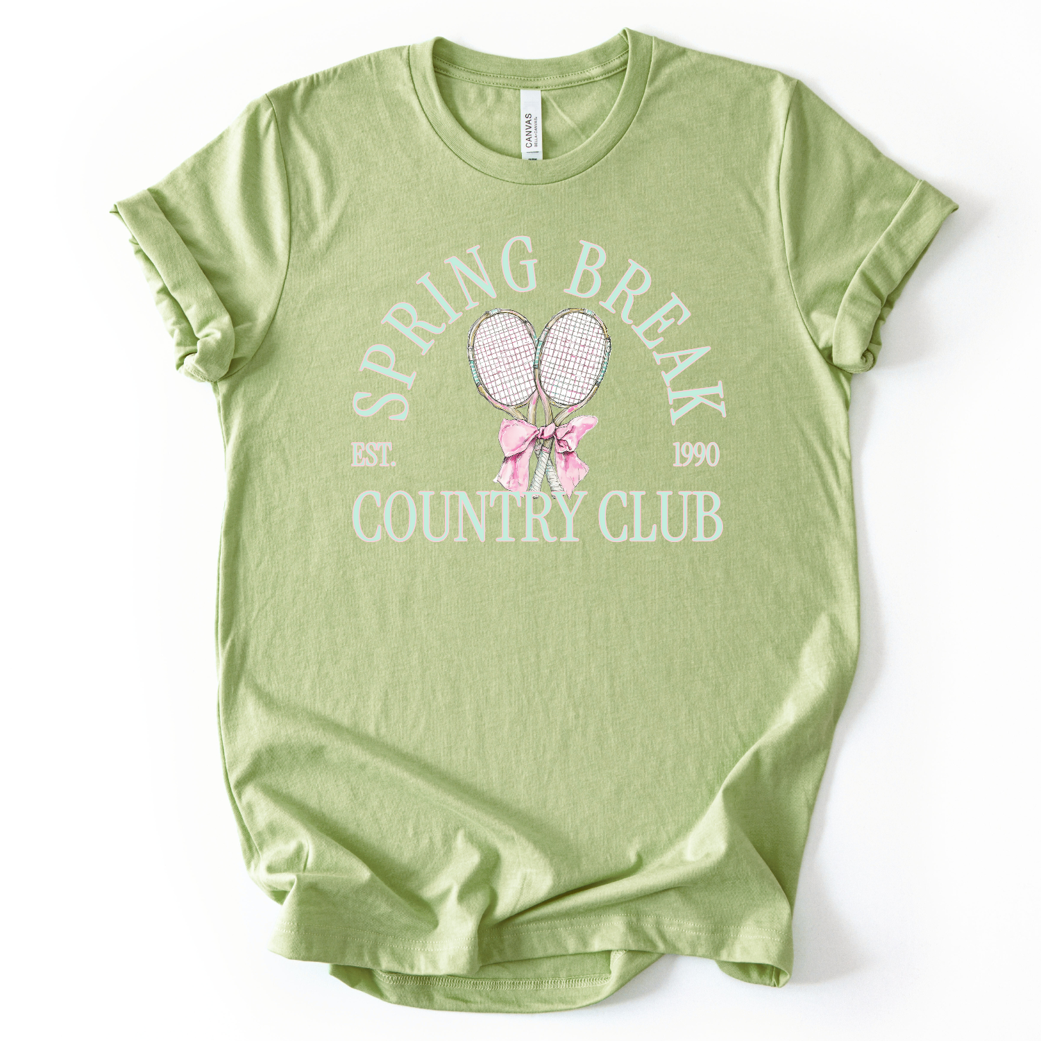 green t-shirt with 'Spring Break Country Club' text and graphics on a white background.The graphic features a pair of illustrated tennis rackets crossed at the handles and tied together with a soft pink ribbon bow at the center. Arched text reads “Spring Break Country Club”, with small accent details adding a classic, collegiate feel. 