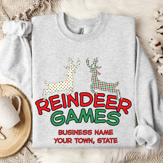Gray sweatshirt with 'Reindeer Games' with a red and green plaid reindeer and a polka dot christmas color reindeer.  below image you can customize with your business name, city and state or both